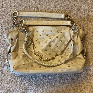 Used cream colored charming Charlie shoulder bag